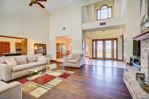 a living room with a couch and a glass table at Florida Vacation Rental with Private Pool and Dock! in Merritt Island