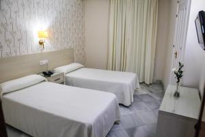 Postel nebo postele na pokoji v ubytování Chaikana