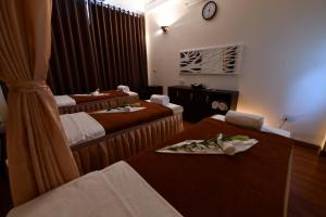 Postel nebo postele na pokoji v ubytování Babylon Premium Hotel & Spa