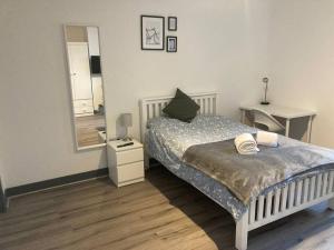 A bed or beds in a room at Newly refurbished studio, great location 8 studios