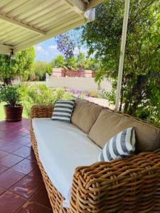 a wicker couch sitting on a patio at Family fun in Vaal Marina in Vaal Marina +14 photos
