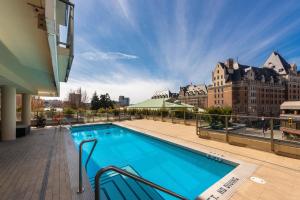 a swimming pool on the roof of a building at Falls Empress Suite by IRIS PROPERTIES! in Victoria