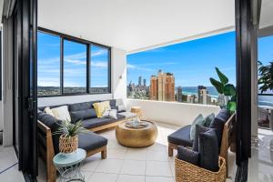 a living room with a view of the city at Aria Apartments in Gold Coast