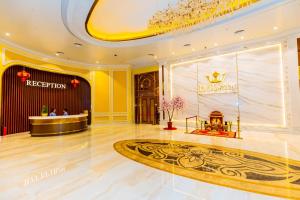 a lobby of a hotel with a reception desk at Dynasty Casino Hotel in Bavet