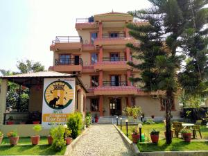 a building with a sign in front of it at HOTEL CROWN HORIZON in Sauraha