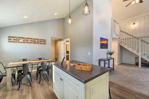 a kitchen and dining room with a table and chairs at Centrally Located Pinedale Vacation Rental! in Pinedale