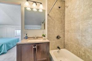 a bathroom with a sink and a tub and a shower at Centrally Located Pinedale Vacation Rental! in Pinedale +20 photos