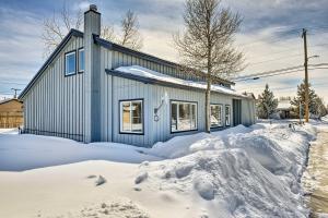 a house is covered in snow in front of it at Centrally Located Pinedale Vacation Rental! in Pinedale