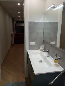 a bathroom with a sink and a mirror at A Casa di Maria 2 in Cavallino di Lecce