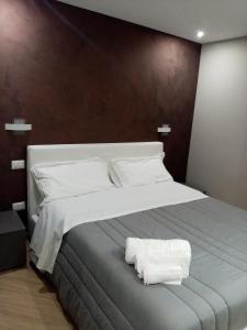 מיטה או מיטות בחדר ב-A Casa di Maria 2
