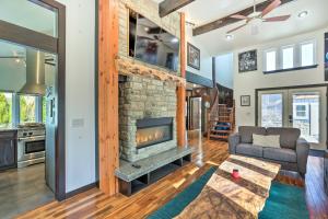 a living room with a fireplace and a couch at Bellingham Vacation Rental with Private Deck in Bellingham