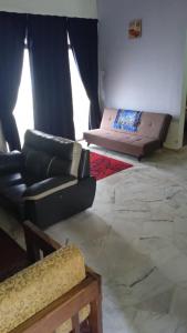 Posezení v ubytování Homestay Budget Bukit Beruntung