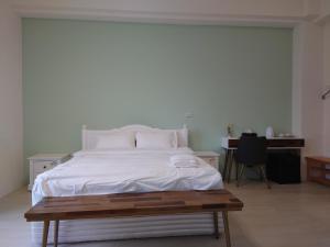 En eller flere senge i et værelse på Green Grass B&B
