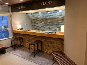 a restaurant with two stools at a bar in a store at Kitami Daiichi Hotel - Vacation STAY 45969v in Kitami