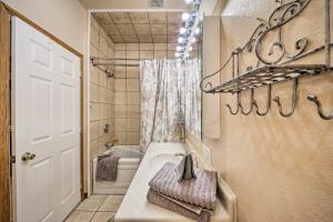 a bathroom with a sink and a toilet and a mirror at Family-Friendly Sagle Vacation Rental with Deck in Sagle +30 photos