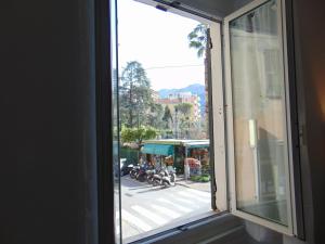 a window with a view of a city street at Casa Da Cri in Rapallo