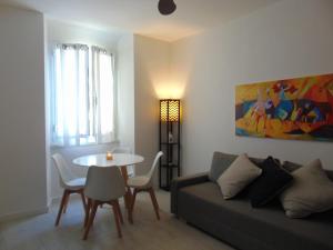 a living room with a couch and a table at Casa Da Cri in Rapallo