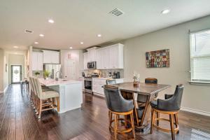 a kitchen with a table and chairs and a counter at San Antonio Vacation Rental with Hot Tub, Yard! in Selma