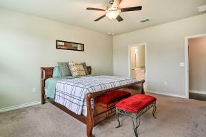 a bedroom with a bed and a ceiling fan at San Antonio Vacation Rental with Hot Tub, Yard! in Selma