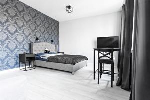 Ένα ή περισσότερα κρεβάτια σε δωμάτιο στο Quiet Apartment Koscielna Old Town