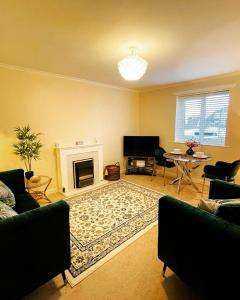 a living room with a couch and a fireplace at Two Double bedrooms apartment near Hull city centre in Hull