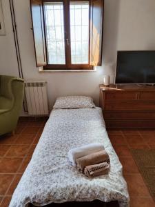 Postel nebo postele na pokoji v ubytování Casale del Tempo Lento