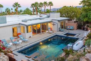 an aerial view of a house with a swimming pool at On The Rocks in Palm Springs
