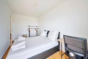 Łóżko lub łóżka w pokoju w obiekcie Magnifique F3 à moins de 15 min de la défense