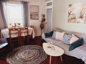 a living room with a couch and a table at Fairytale in Boïkátika