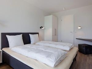 Postel nebo postele na pokoji v ubytování 6 Personen Ferienhaus in Wendtorf