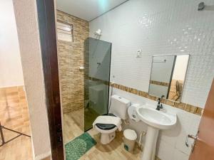 a bathroom with a toilet and a sink at HOTEL CAJUÍNA BEACH in Parnaíba +9 photos