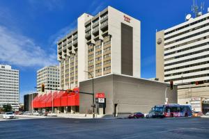 a large building on a city street with at Ramada Plaza by Wyndham Regina Downtown in Regina