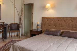 Posteľ alebo postele v izbe v ubytovaní Hagiati Anastasiou Hotel & Spa