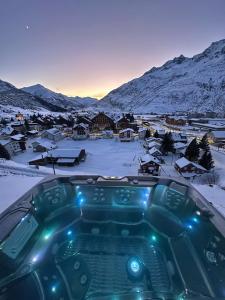 a view of a town in the snow at Basecamp Andermatt in Andermatt