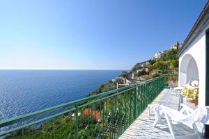 a balcony with a view of the ocean at Alba di Praiano in Praiano