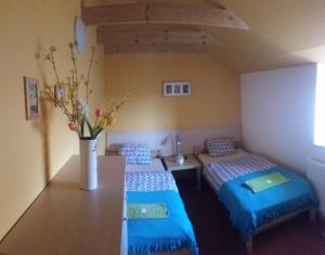Postel nebo postele na pokoji v ubytování Penzion Cihelna