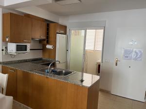 Kuchyň nebo kuchyňský kout v ubytování Apartamento Canet d’en Berenguer