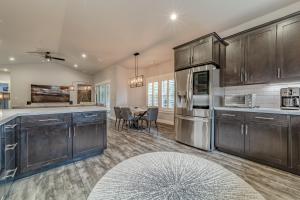 a kitchen with wooden cabinets and a dining room at Mojo's Dojo in McKinleyville