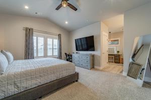 a bedroom with a bed and a flat screen tv at Mojo's Dojo in McKinleyville