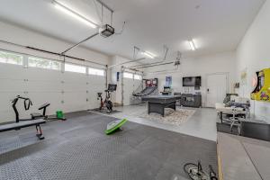 a room with a gym with a ping pong table at Mojo's Dojo in McKinleyville