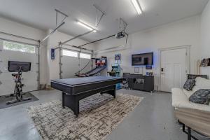 a garage with a piano in a room with a couch at Mojo's Dojo in McKinleyville
