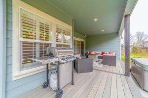 a patio with a grill on a house at Mojo's Dojo in McKinleyville