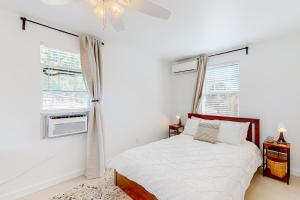 Ένα ή περισσότερα κρεβάτια σε δωμάτιο στο Tropical Hideway