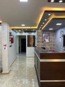 a lobby with a reception desk in a building at Petra Sofsaf Hotel in Wadi Musa