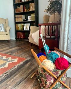 a living room with a chair with balls of yarn at Patios del Agua in El Puerto de Santa María