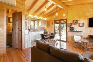 a living room with a couch and a table at Rural Cottage in Alfeizerão