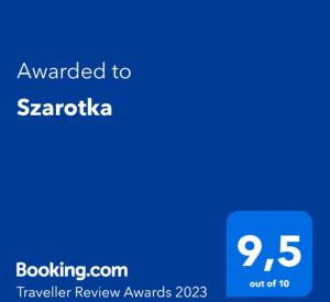 niebieski ekran z tekstem przyznanym sarajevicy w obiekcie Szarotka w Bukowinie Tatrzańskiej