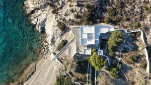 an aerial view of a building on the beach at IosVilla at Sapounohoma in Mylopotas