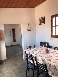 a dining room with a table with a teddy bear on it at Miskysisa in Humahuaca