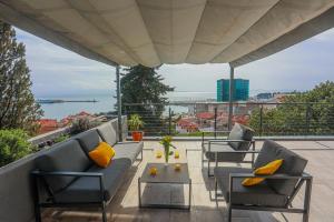 Balkón nebo terasa v ubytování AMAI APARTMENT